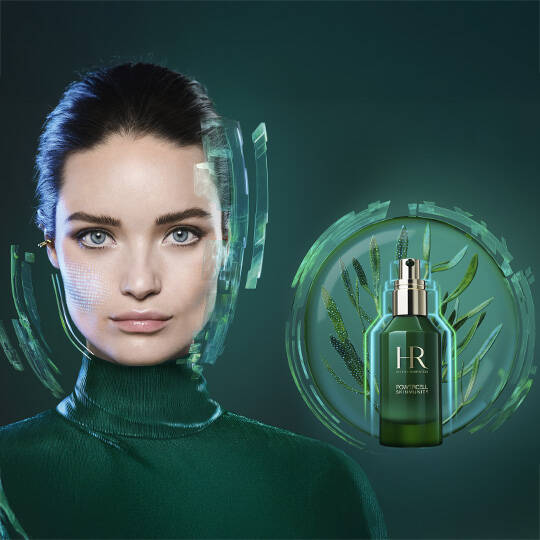 A woman with dark hair and a green turtleneck looks at the camera. A bottle of Helena Rubinstein Powercell Skinmunity serum is superimposed on a circular graphic with green leaves, against a dark green background.
